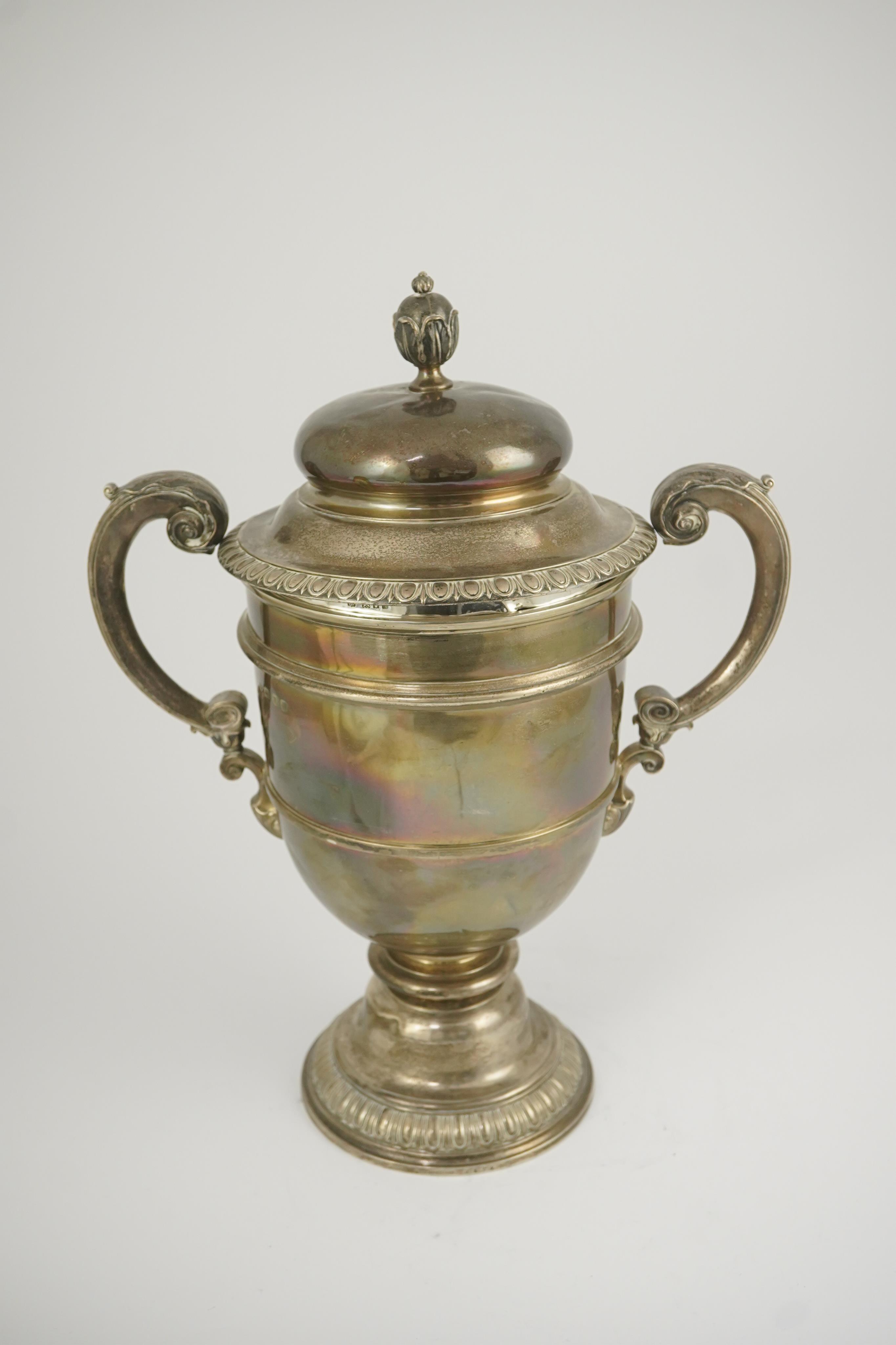 A George V silver two handled presentation trophy cup and cover by Hunt & Roskell Ltd (late Storr & Mortimer)